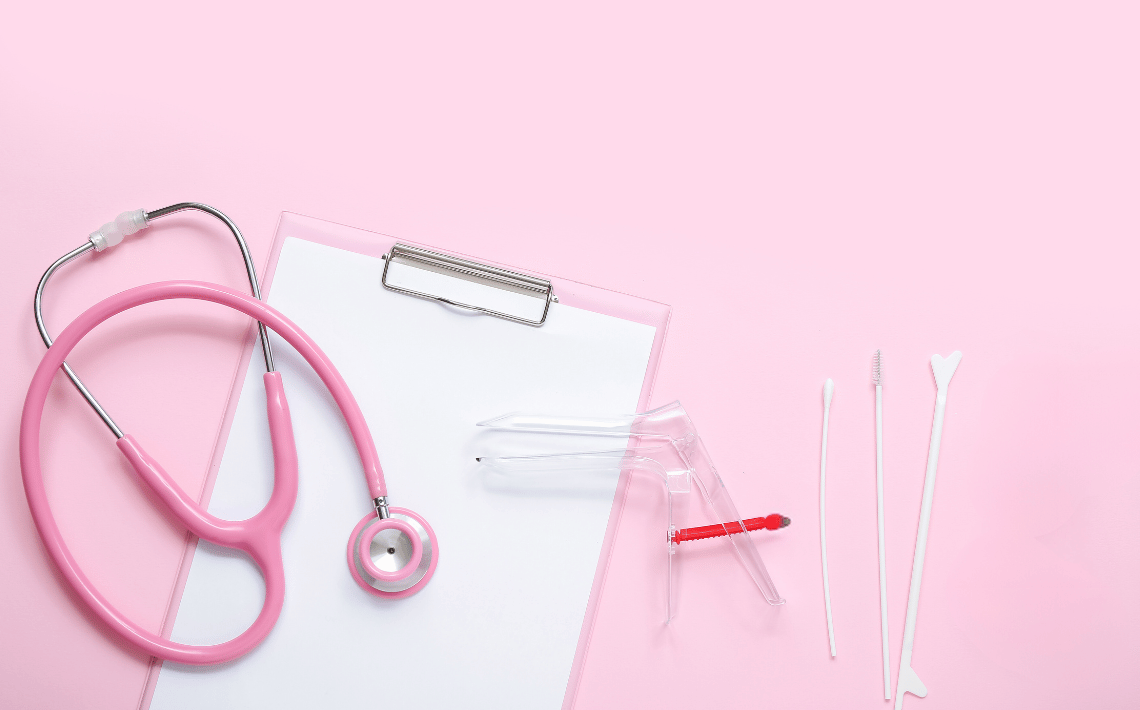 pink background with pink stethoscope, speculum and swabs
