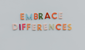 Multi coloured words saying 'Embrace Differences'