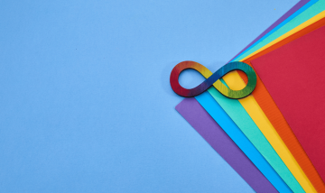 autism infinity symbol on coloured paper background