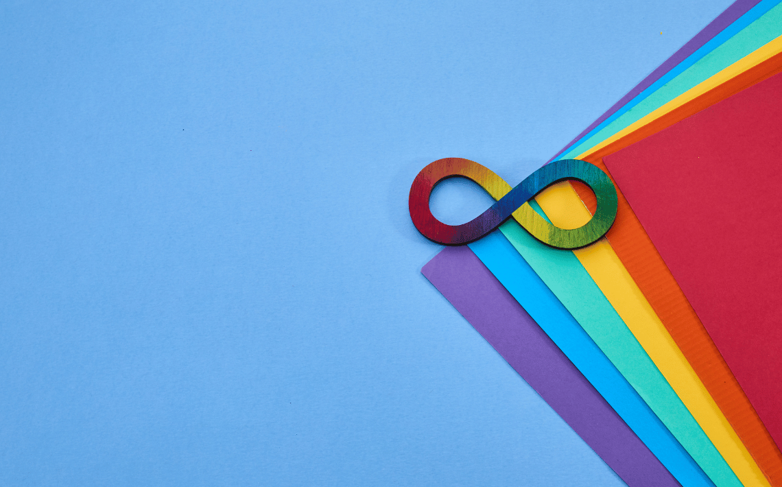 autism infinity symbol on coloured paper background