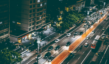 busy city street with cars and buses