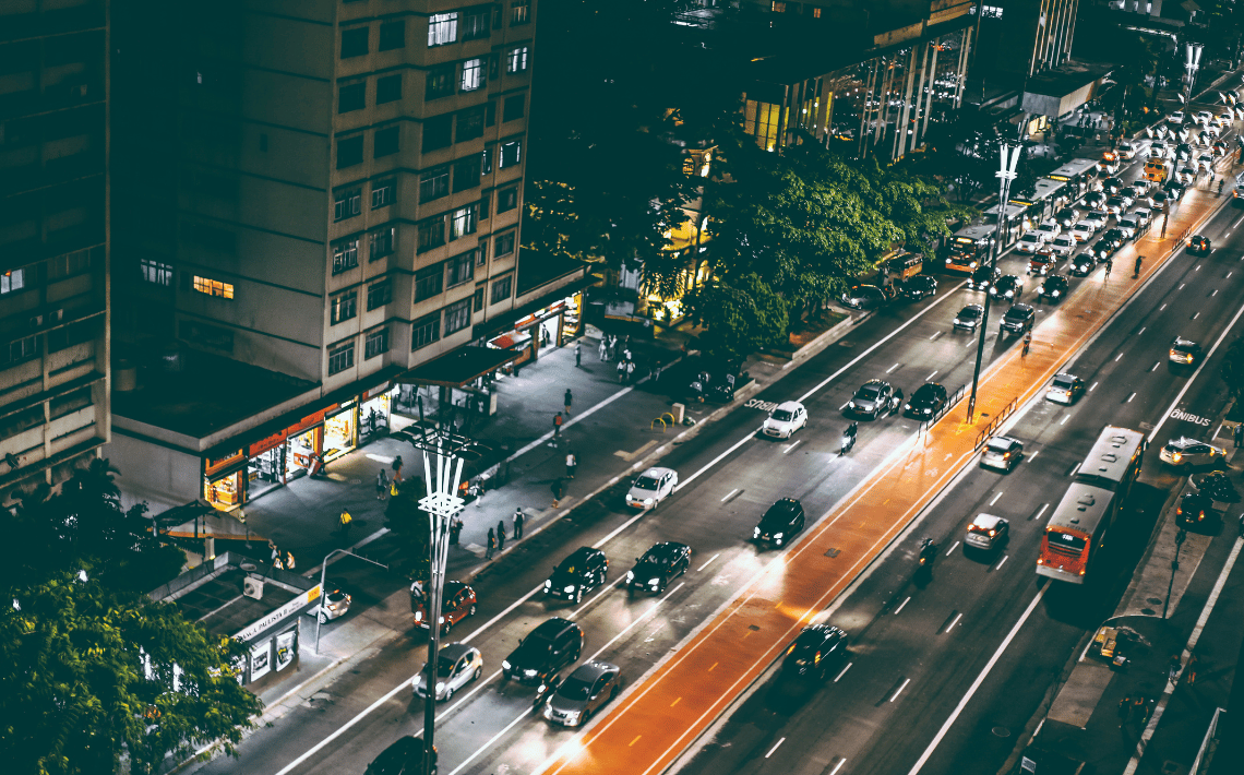 busy city street with cars and buses